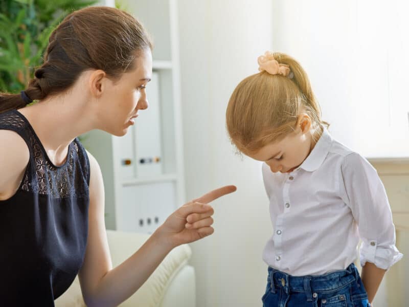 Angry parent expressing frustration towards a child.